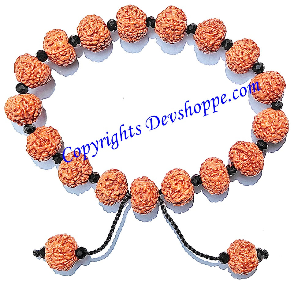 Rudraksha 7 mukhi bracelet with glass spacers: orange textured beads and black spacers