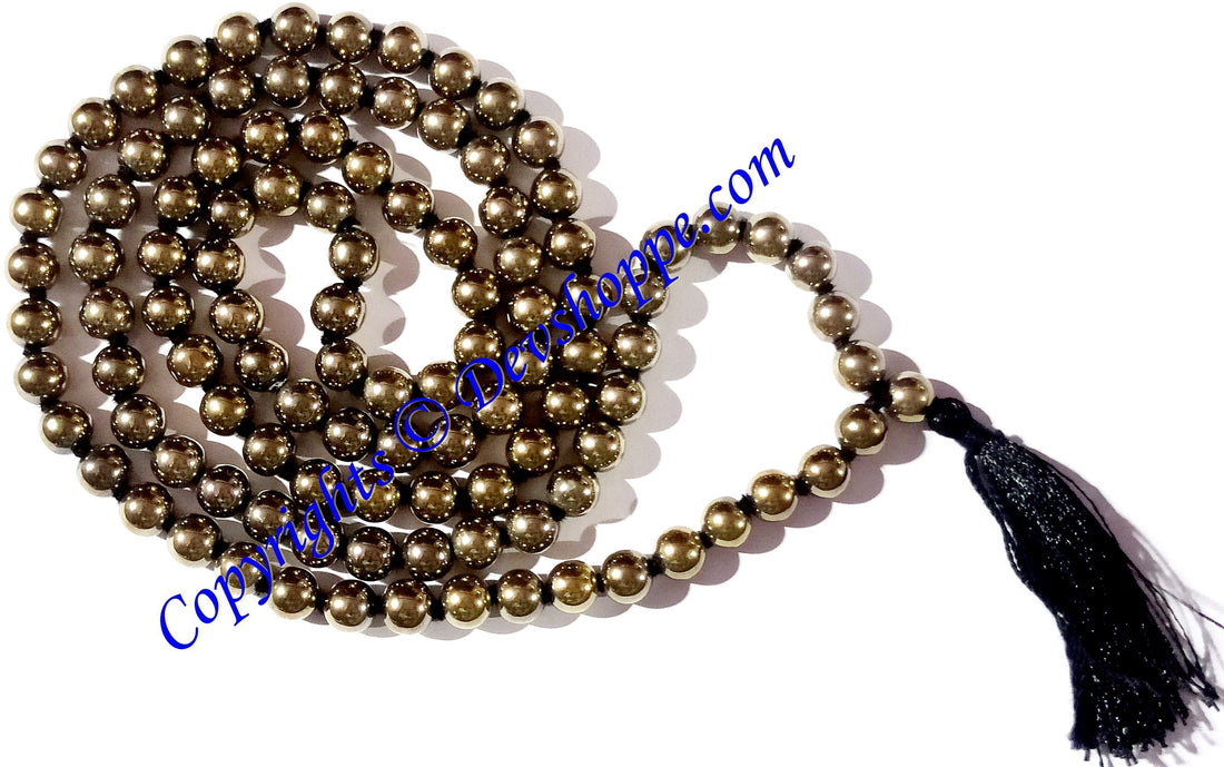 Golden pyrite mala with round metallic-gold beads and dark tassel