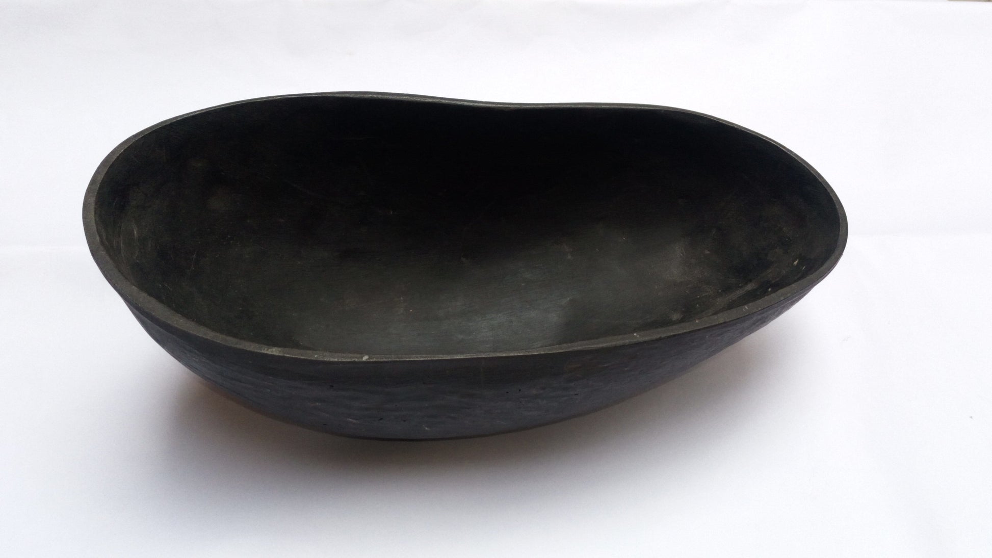 Dark coco de mer khappar, shallow round dish with curved sides and rim