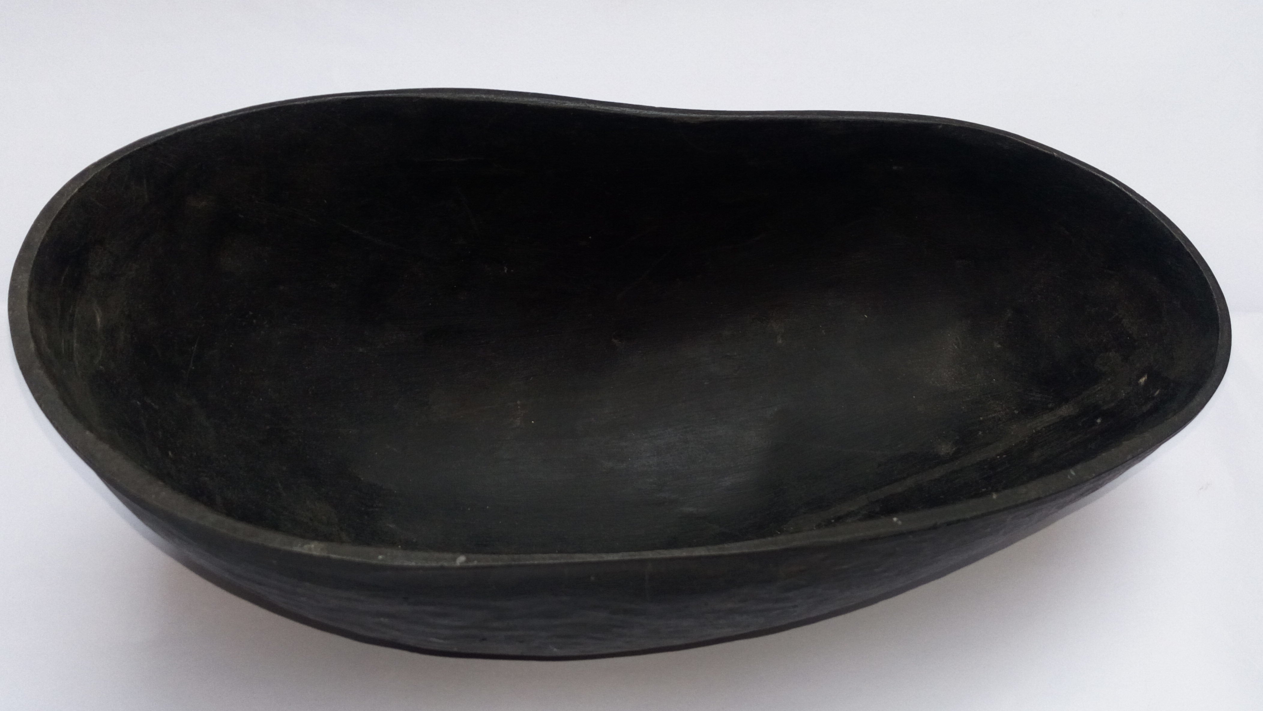 Dark coco de mer khappar, shallow bowl with wide rim and smooth interior