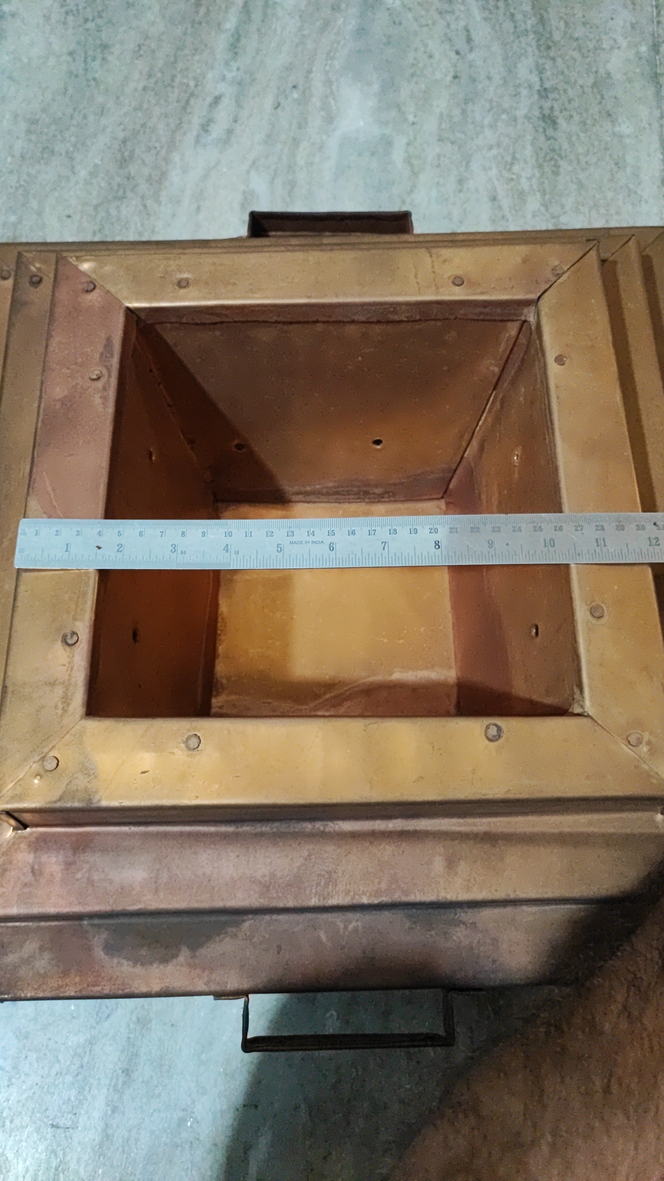 Copper havankunda open top with ruler laid across the opening for sizing