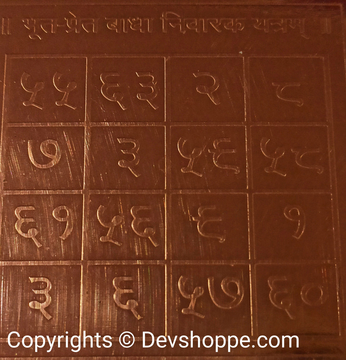 Copper Sri Bhoot Pret Badha Nivaran Yantra with engraved geometric protective symbols
