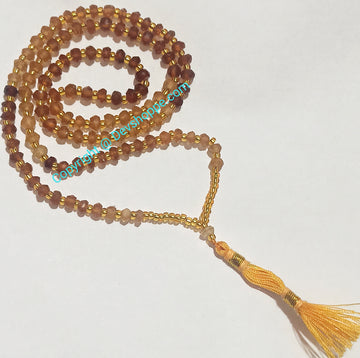 Gomed mala (Hessonite) mit goldenen Spacer-Perlen und Quaste, 108+1 Perlen