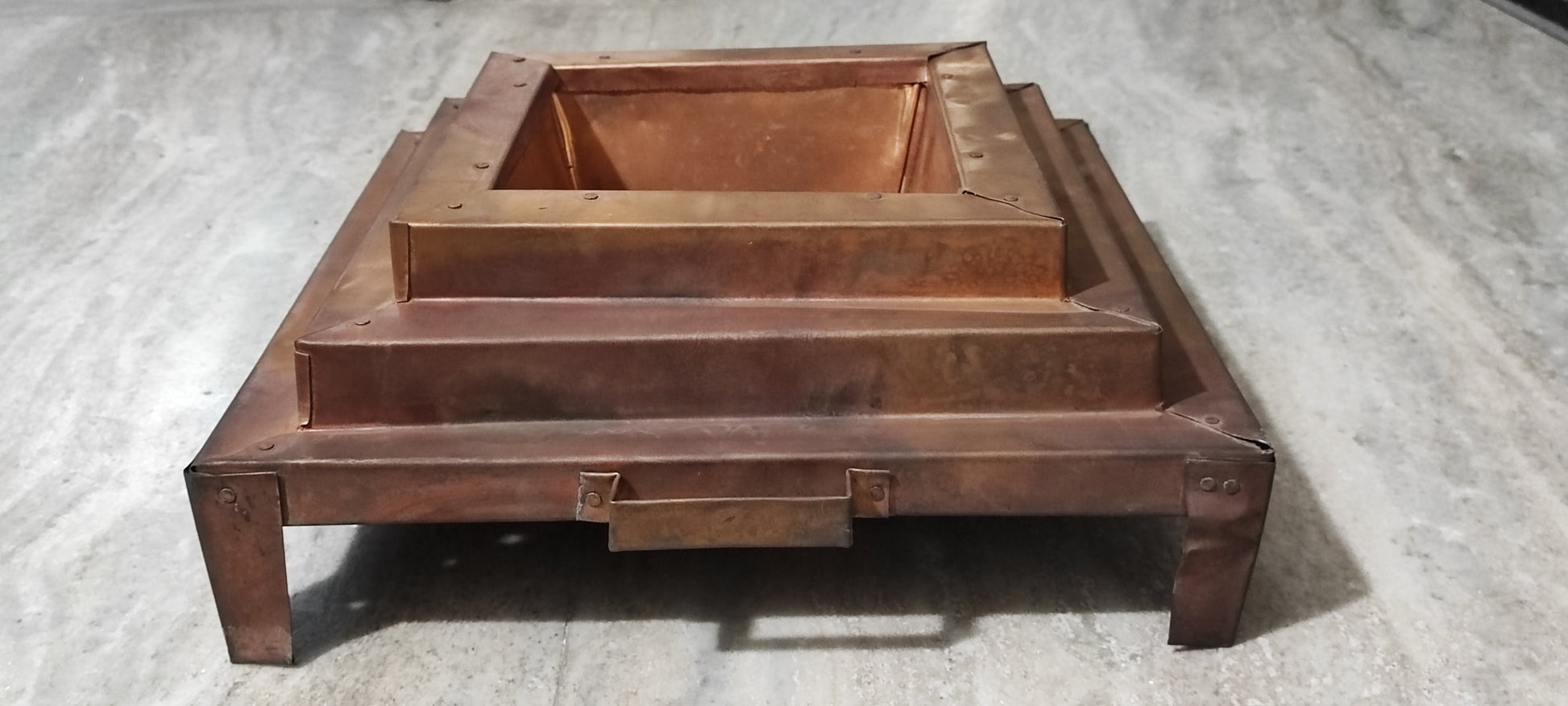 Big copper havankunda with raised front step, side view and central handle bar