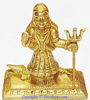 Khodiyar maa idol in brass with raised right hand and ornate jewelry, holding staff