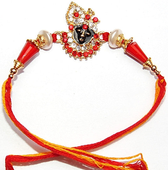 Shri Krishna rakhi bracelet with jeweled face, red stones, pearl beads, red thread