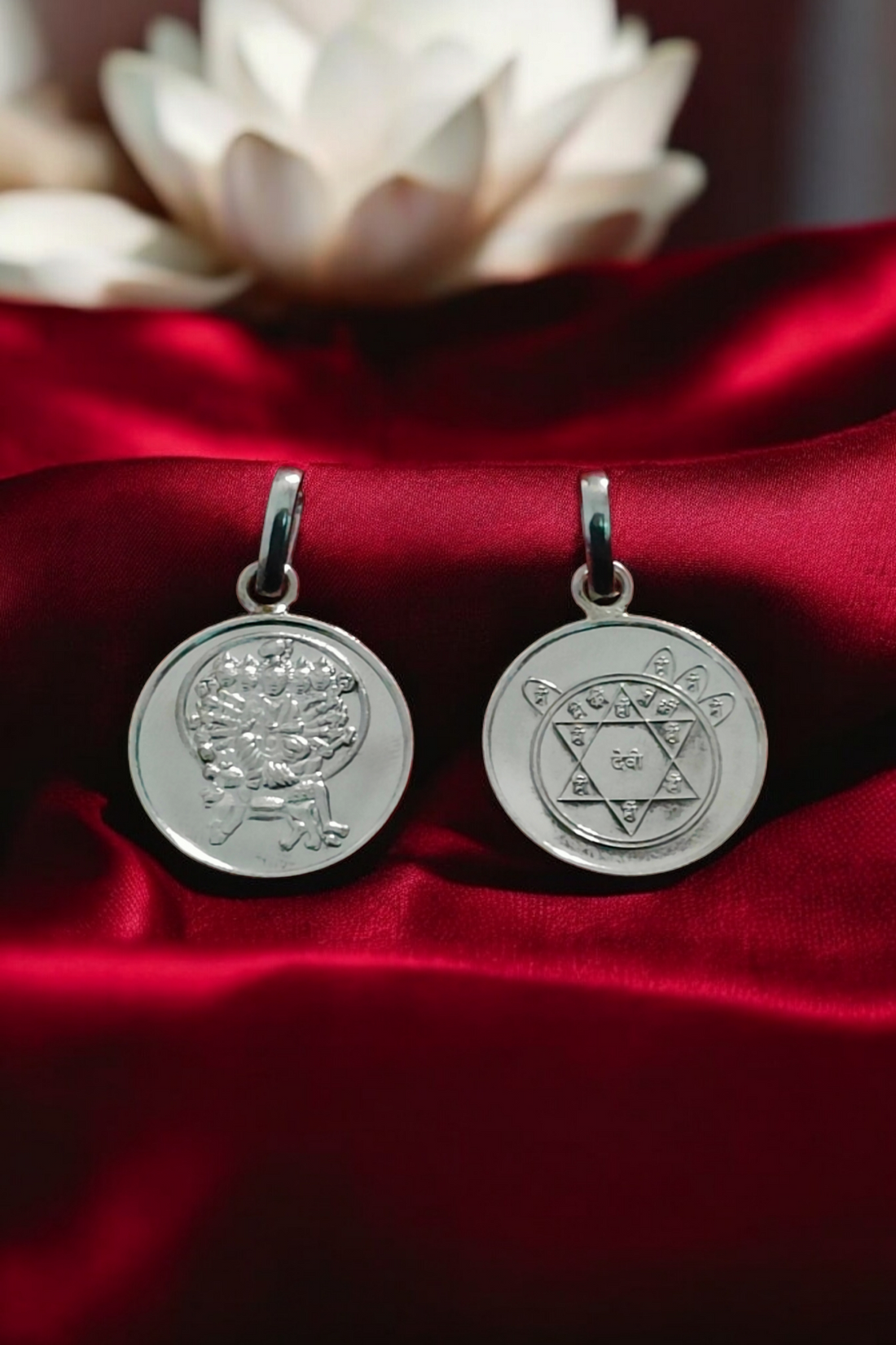 Sri Kamakhya yantra silvery circular pendant pair with etched geometric design.
