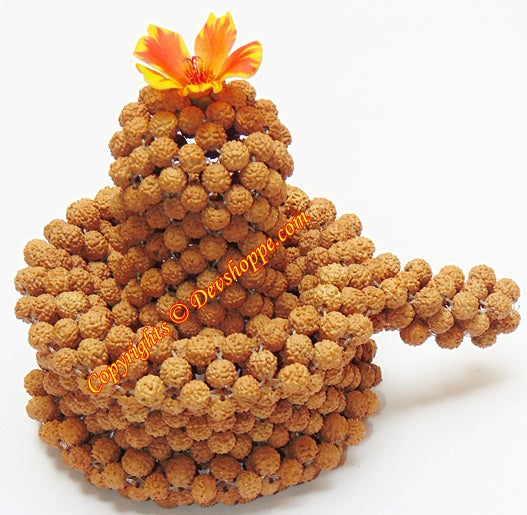 Rudraksha shivling of brown 5 mukhi bead clusters with orange flower on top