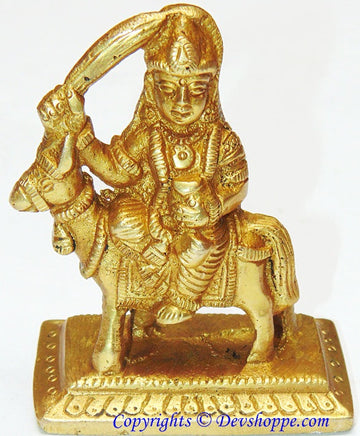 Shitala mata brass idol, seated figure with raised arm and detailed jewelry