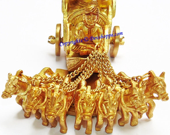 Brass Surya idol front view, bearded seated deity with cart wheels