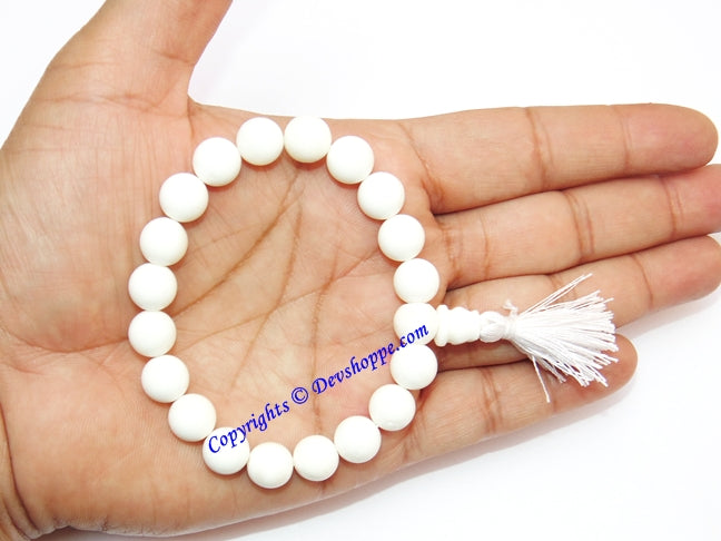 White agate power bracelet with round beads and white tassel on stretch elastic