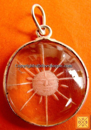 Circular crystal sun pendant in white metal, hand-carved detail