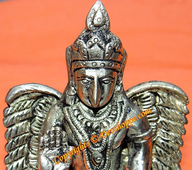 Garuda panchdhatu statue head and wings, ornate crown, detailed chest jewelry, folded hands