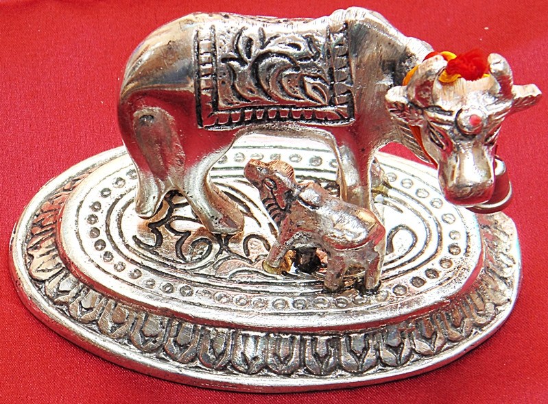 White metal cow and calf idol, engraved base with bells