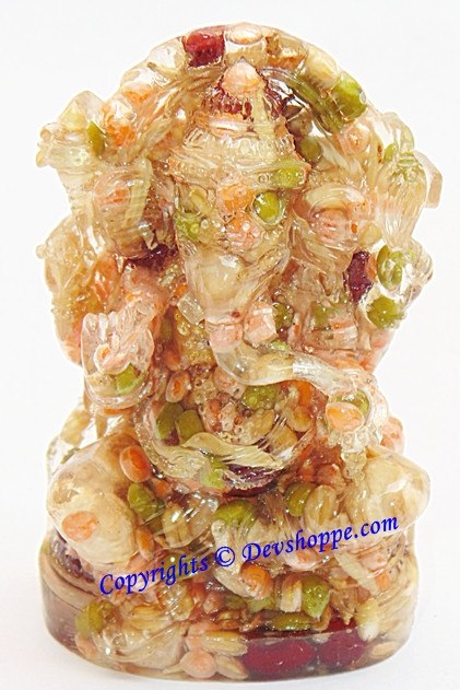 Ganesha idol figurine with multicolored gemstone-like stones, front view