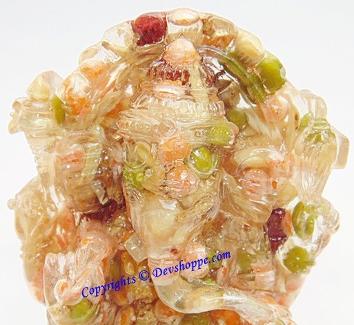 Ganesha idol figurine with multicolored stones, side view