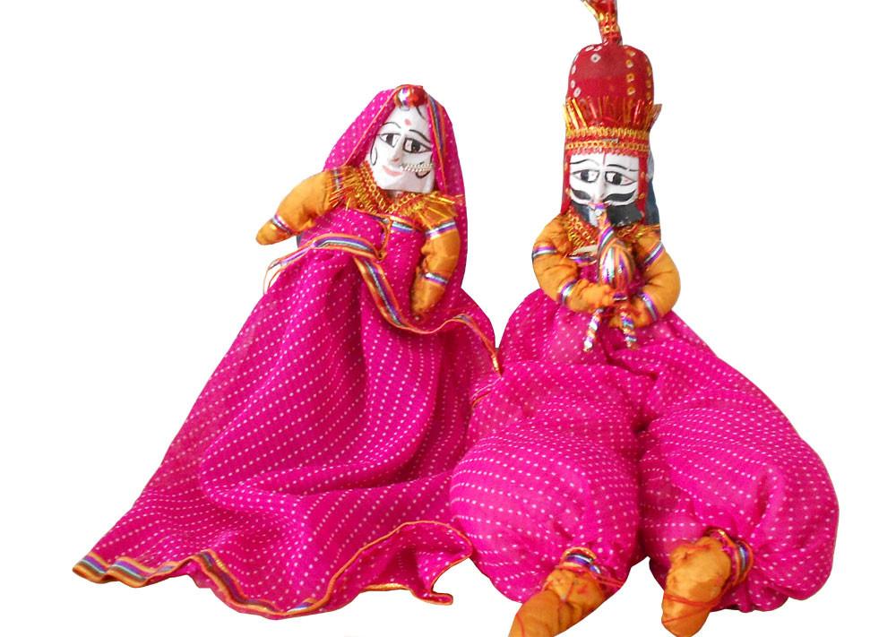 Rajasthani cloth kathputli puppets—king and queen in pink and orange, door hanging
