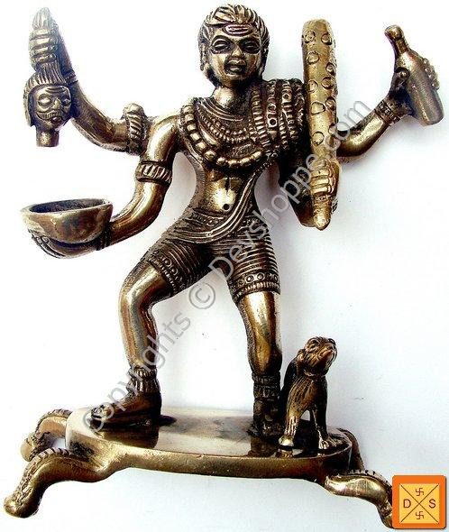 Sri Kal Bhairav idol in bronze tone, four-armed standing posture with trident-like weapon.