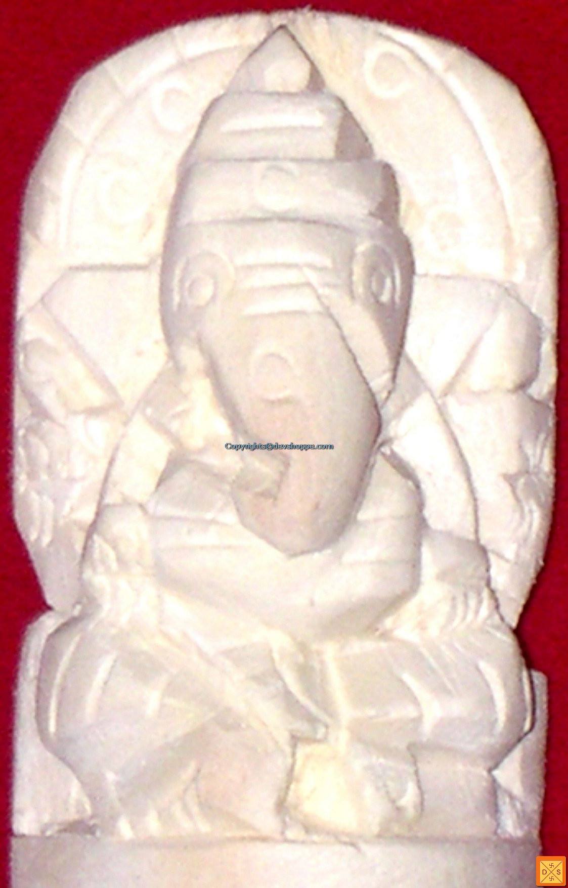 Carved Ganapati figurine in light ivory tone from Madar root, seated relief