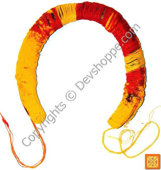 Protective horseshoe charm, red and yellow fabric with strings