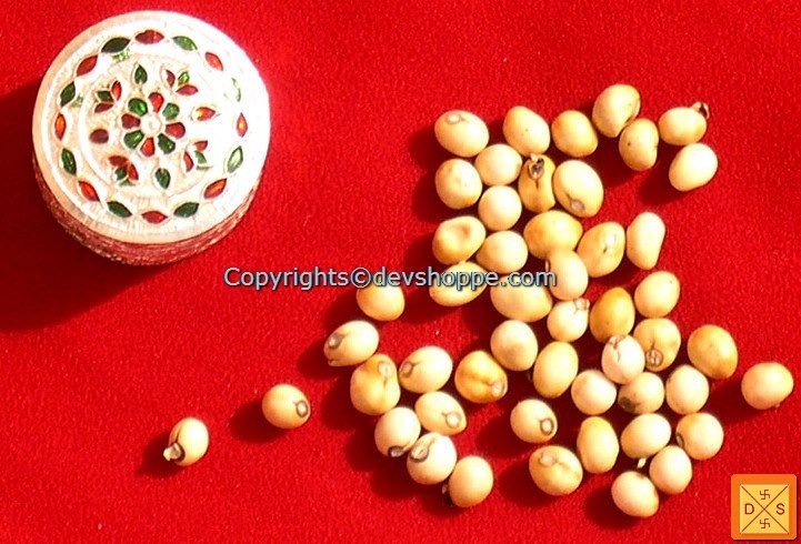 White chirmi beads with silver box tin lid and scattered bead pieces
