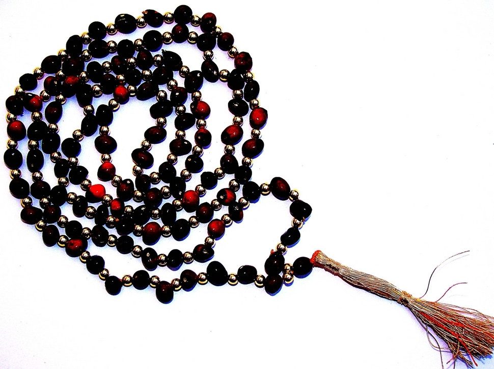 Black Chirmi mala with dark beads, red accents, and braided tassel end
