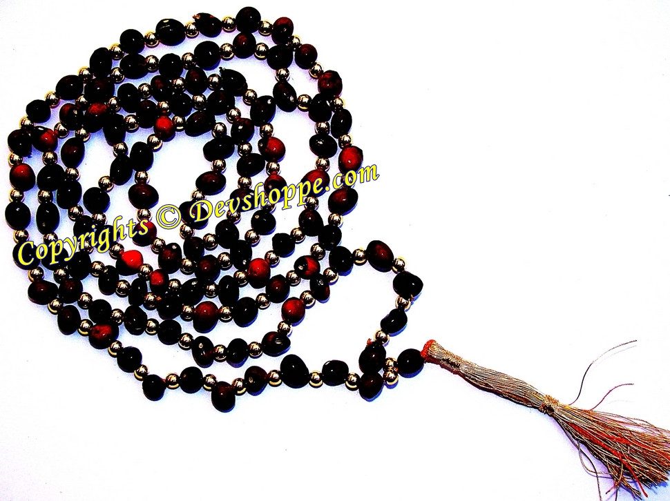 Black Chirmi mala with dark beads, red accents, and braided tassel end