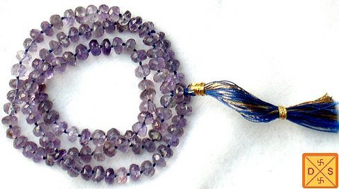Light purple amethyst mala with faceted beads and blue tassel
