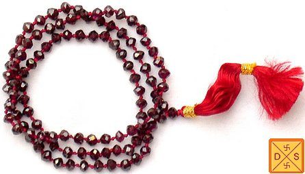 Garnet faceted beads mala with red tassel and gold-tone spacers