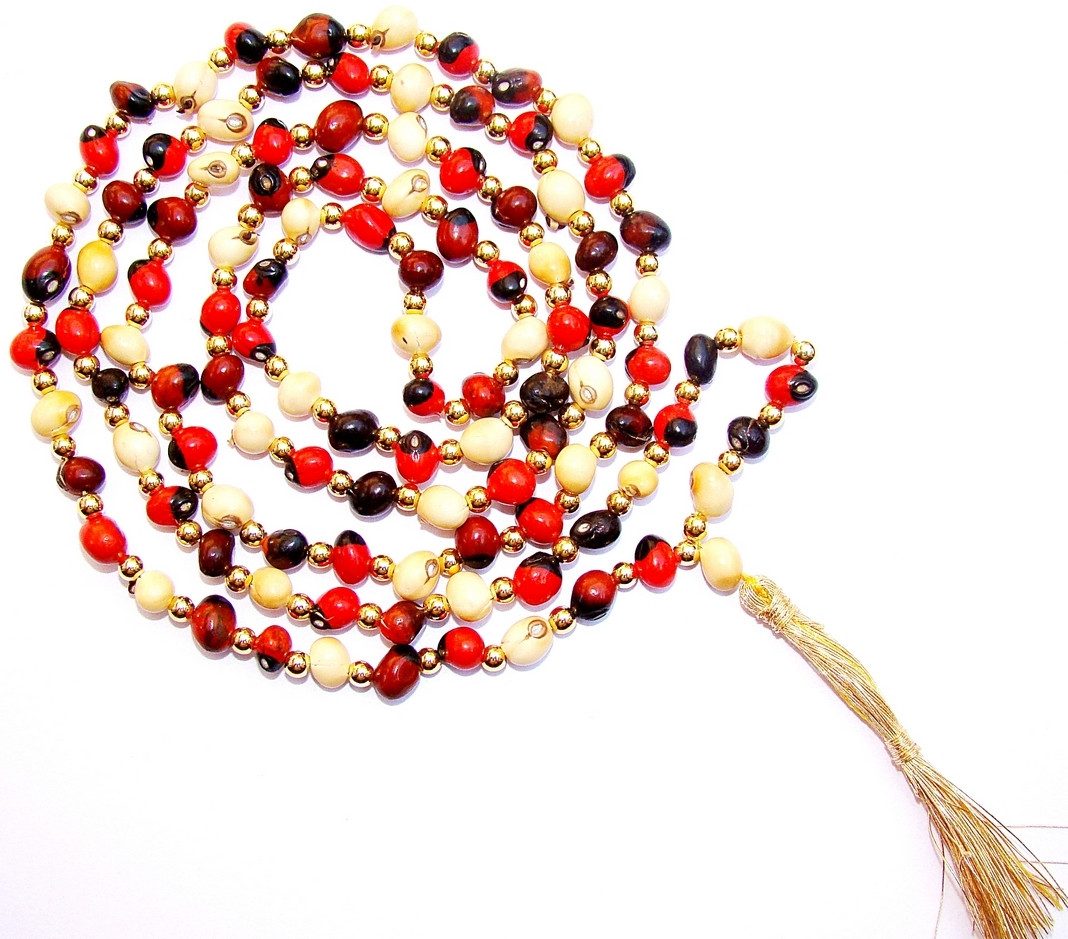 Mixed chirmi beaded mala with white, black and red beads; gold tassel.