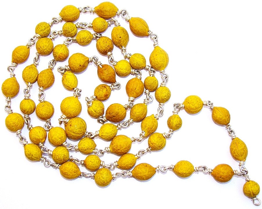 Putrajeeva mala in white metal with round yellow bead strands and silver links