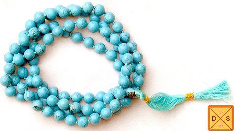Reconstituted turquoise mala bead necklace with gold spacer and blue tassel