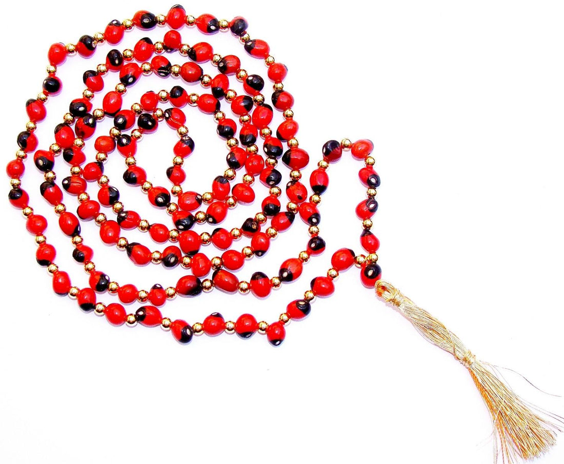 Red and black bead mala with gold accents and tassel charm cord
