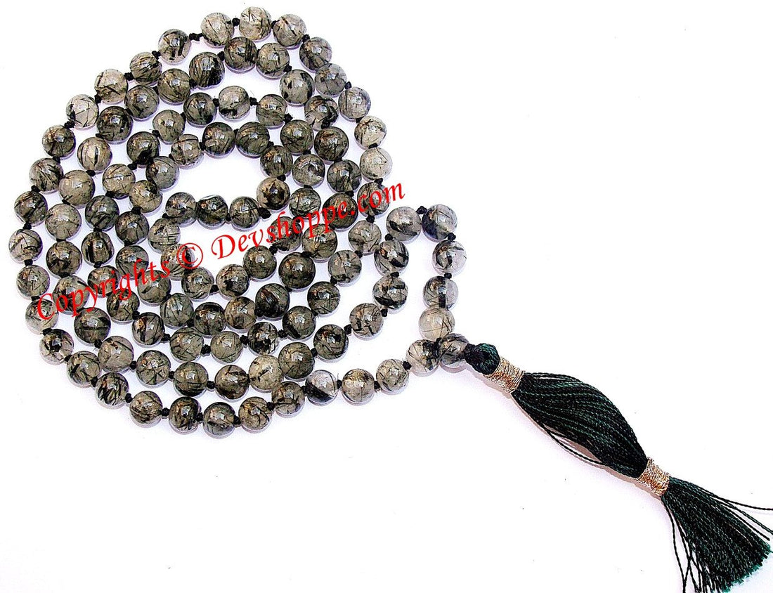 Rutile quartz mala with round metallic beads and black tassel, single strand