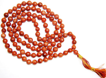 Sunstone faceted bead mala necklace with orange-red beads and gold tassel