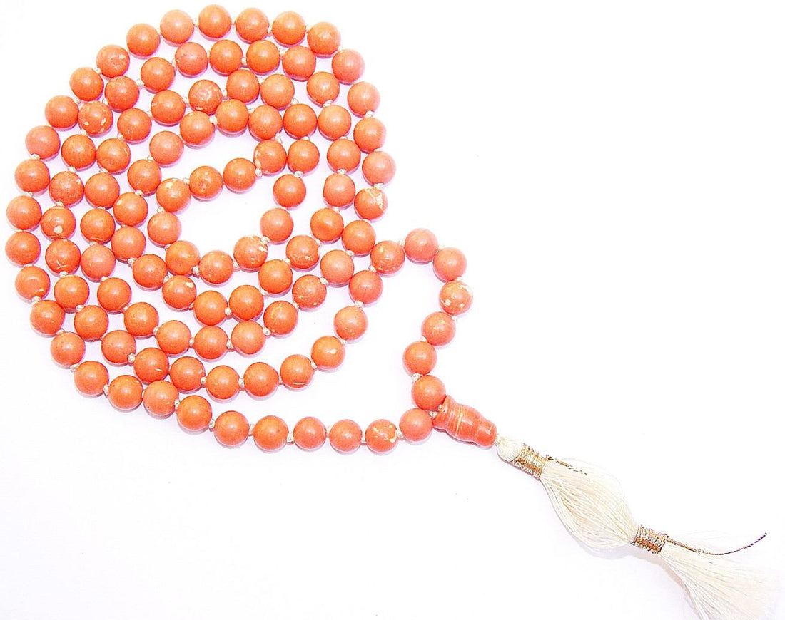 Tibetan churu mala with orange bead strands and white tassel