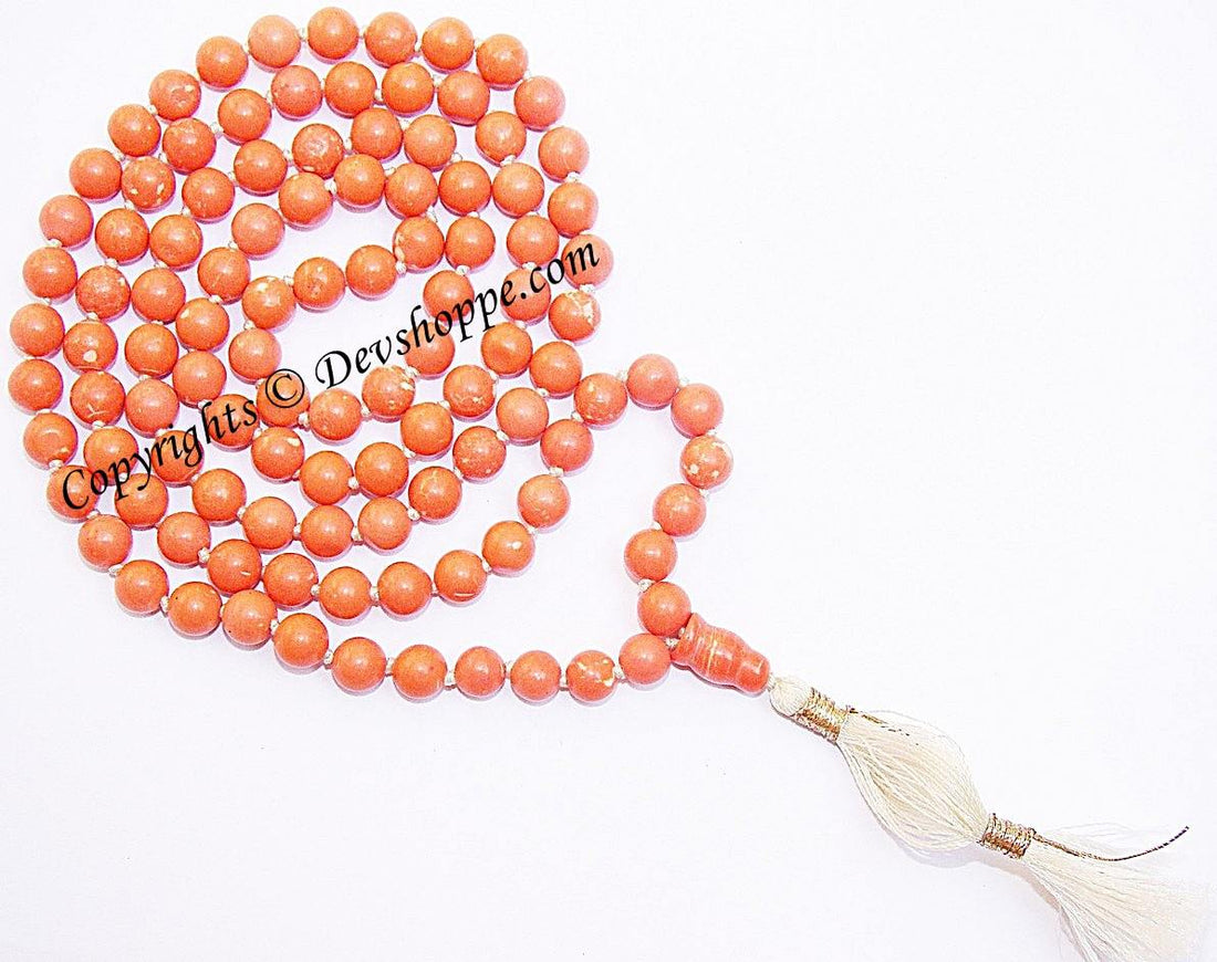 Tibetan churu mala with orange bead strands and white tassel