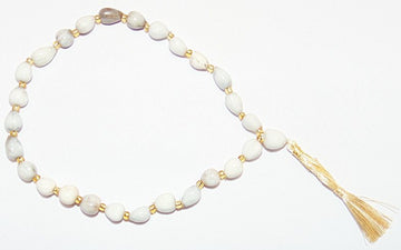 Vaijanti wrist mala: opalescent white beads with gold spacers and gold tassel