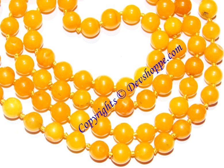 Yellow jade mala with round beads and tassel end
