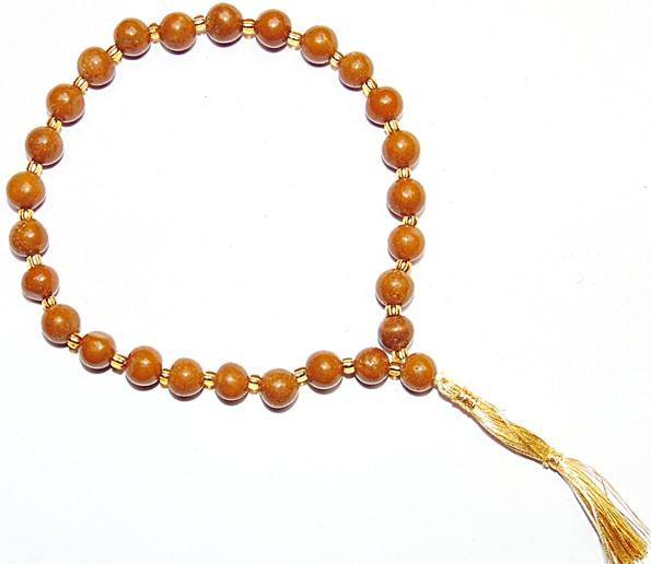 Yellow jasper wrist mala bracelet with 27 beads and gold tassel
