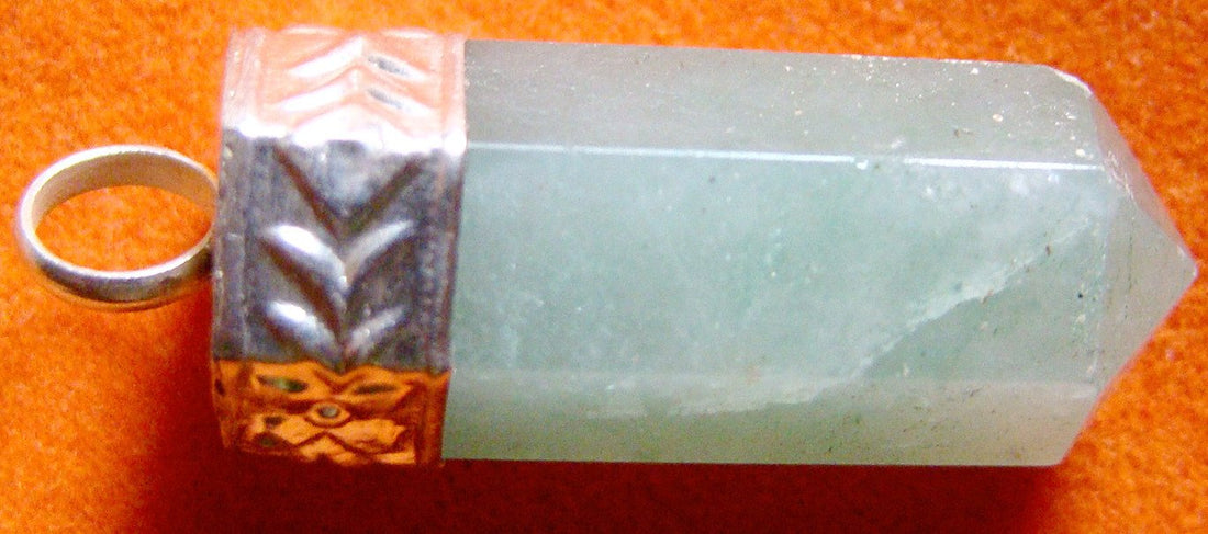 Green jade pencil-shaped pendant with sterling silver cap and etched band