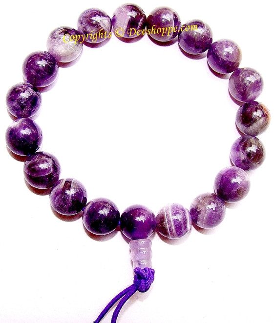 Amethyst power bracelet with purple polished beads and tied tassel cord