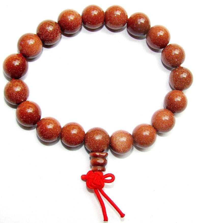 Sunstone power bracelet with red/gold beads and red tied charm