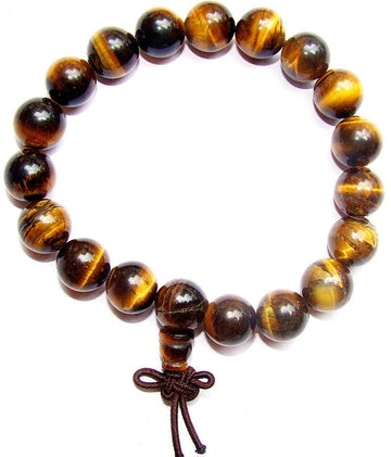 Tiger eye power bracelet with round brown-gold beads and knot tassel charm