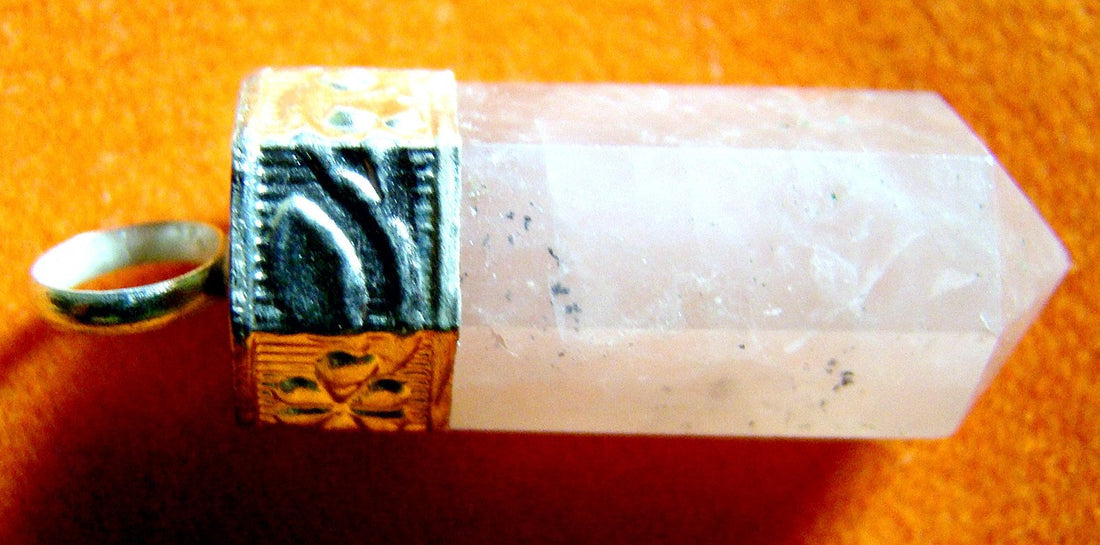Rose quartz pencil-shaped pendant with sterling silver bezel and silver bands