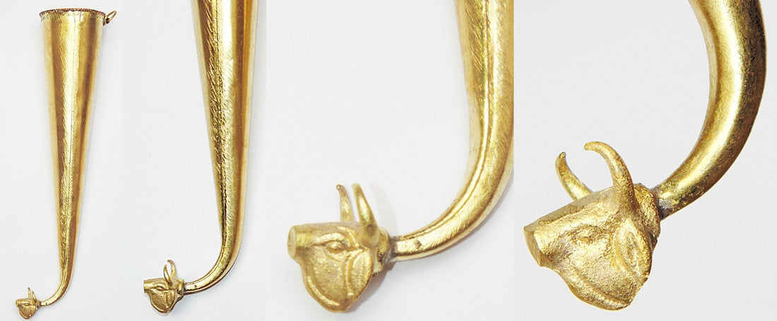 Gaumukhi Shringi ritual vessel, gold-toned, curved horn with cow-face finial