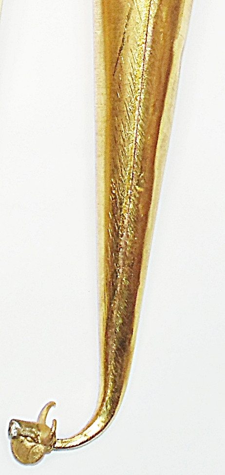 Gold ritual vessel cone with embossed texture and curved spout leading to the head