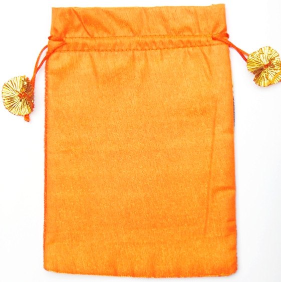 Orange fabric pouch bag with drawstring top and gold tassel ends
