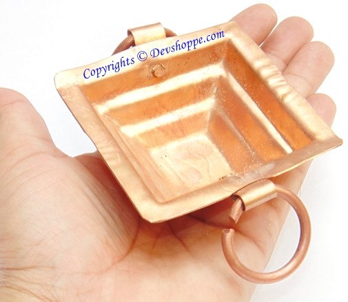 Small pure copper havan kund held in hand, square inner bowl with loop handle