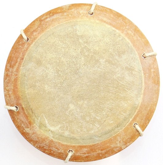 Deru drumhead close-up with tan skin and small rope attachment loops